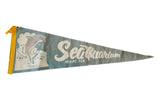 Vintage Miami Sea Aquarium felt pennant, circa 1950s, teal with jumping dolphin graphic.