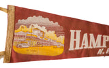 Vintage red felt Hampton Beach NH pennant; yellow casino graphic, white 'HAMP' letters, surface creases.