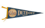 Vintage Detroit Mich. felt pennant in blue with cream city skyline, 'DETROIT MICH.' lettering, and yellow trim.