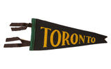 Handmade vintage Toronto felt flag, black with yellow text, green edge, brown ties, 4x9.