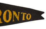 Close-up of the Handmade Toronto felt flag, showing yellow 