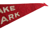 Vintage red felt pennant showing white 'KE ARK' letters and pointed tip.