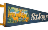 Detail of the vintage St. Johnsbury VT felt pennant with deer, pines, and white text.