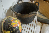 Black textured recycled rubber basket with a rounded top handle.