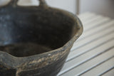 Dark recycled rubber basket rim showcasing its rugged texture and signs of age.