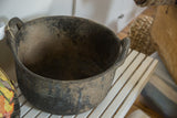 Dark, grooved texture and dusty interior of the recycled rubber basket.