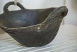 Dark recycled rubber basket with worn texture, embossed pattern, and sturdy handle.
