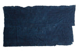 Collectible hand-woven African indigo textile featuring a dark blue textured finish.