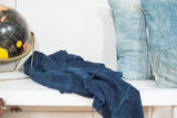 Dark blue denim indigo throw, highlighting the handwoven cotton texture and rich color.