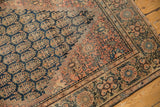 Antique Farahan Sarouk rug with navy boteh field, dusty cochineal red border, and even wear.
