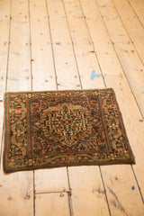 A vintage Josan Sarouk rug's full pattern seen from a high, angled perspective.