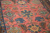 Cranberry red field and soft cobalt blue floral motifs on a vintage Lilihan Sarouk rug.