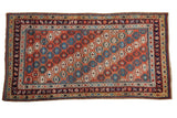 Antique Caucasian rug, circa 1890, with a red-orange abrash field and varied geometric octagonal motifs.