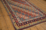 Layered geometric borders and secured fringe on a late 19th century Caucasian rug corner.