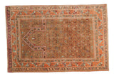Vintage Indo Caucasian rug in light camel brown and peachy pink with uni-directional geometric patterns.