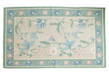 Vintage Dhurrie carpet with eggshell field, honeydew green border, blush and blue floral design, 5' x 8'4