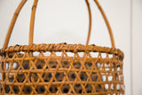 Hand-woven criss-cross pattern and tightly coiled rim of the vintage Japanese basket.