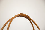 Hand-woven handle detail of the vintage Japanese basket, with wrapped grip.