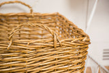 Detailed view of the natural woven wicker texture and twisted handle.