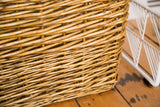 Close-up of the vintage wicker basket's rich woven texture and natural patina.