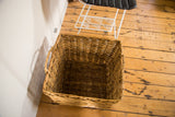 Hand-woven natural wicker texture of the vintage basket's interior and sides.