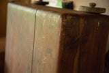 Vintage cedar chest in rich reddish-brown wood, showcasing aged patina and rounded corner.