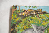 Chipped corner of vintage Malaysian painting with vibrant spotted leopard in green foliage.