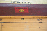 Red textured map casing with 'Markable-Kleenable' label, marked wooden dowel, and U.S. bracket.