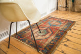 Vivid geometric design and naturally distressed pile of an antique Bakshaish rug.