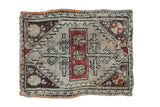 Distressed antique Turkish Oushak rug mat with brick red medallion, serrated tree motifs, ivory, and charcoal.