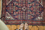 Vintage Tajabad rug showing vibrant indigo herati field and intricate contrasting border.