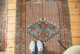 Rare antique Malayer rug with unusual ruby red, aqua blue channels and geometric patterns.