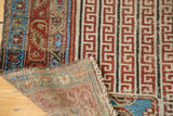 Hand-knotted foundation and detailed ruby red geometric patterns of antique Malayer rug.