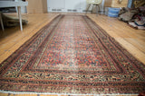 Vintage Northwest Persian runner, Guli Hannai Serbend motifs, terracotta and blue, storied texture.