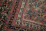 Distressed Mir Serbend runner corner with Guli Hannai field and classic vine border.