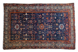 Antique Malayer rug, circa 1910, geometric medallions on vibrant blue field, red-orange, saffron.