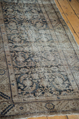 Distressed antique Hamadan rug runner with faded dark teal herati motifs and wide border.