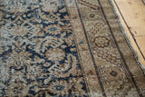 Distressed antique Hamadan runner, showing dark teal Herati motif and wide patterned border.