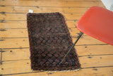Unusual antique Belouch rug with allover repeating plum and indigo boteh pattern.