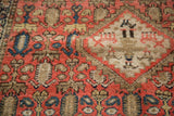 Antique Malayer rug detail: time-softened red, indigo blue, and pictorial animal-tree motifs.