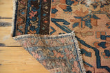 Hand-knotted weave and aged side binding of the antique Lilihan rug, showing blush and indigo.