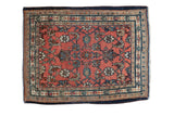 Vintage Persian Bibikabad sampler rug with dusty blush rose red Herati motif.