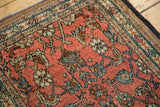 Hand-knotted Bibikabad rug detail showing dusty blush rose field with intricate herati design.