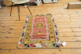 Secured fringe and vibrant geometric patterns of this vintage Turkish Kilim rug.