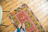 Vintage Turkish Kilim rug with simple geometric design in blush red and lime green.