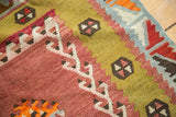 Hand-woven vintage Kilim texture, featuring serrated lime green and blush red patterns.