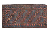 Antique Belouch runner with multi-paneled gul motifs, indigo, bronze, and chestnut.