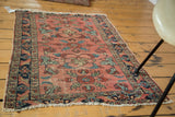 Distressed pile on a Persian Lilihan rug, showcasing navy border and whimsical florals.