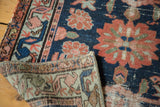 Close-up of the hand-knotted Lilihan rug's distressed navy pile and woven foundation.