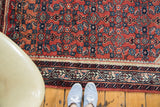 Vintage Engelas rug with a cherry red field and intricate lavender, azure blue border.